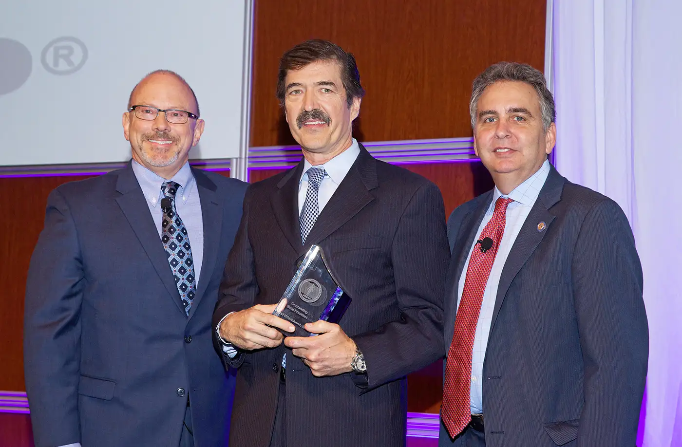 Dr. Hilgenhurst receiving his ASIPP award